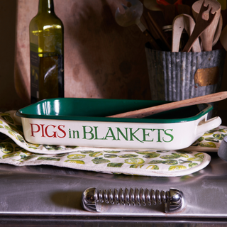 Pigs in blanket tray, olive patterned oven gloes and olive oil