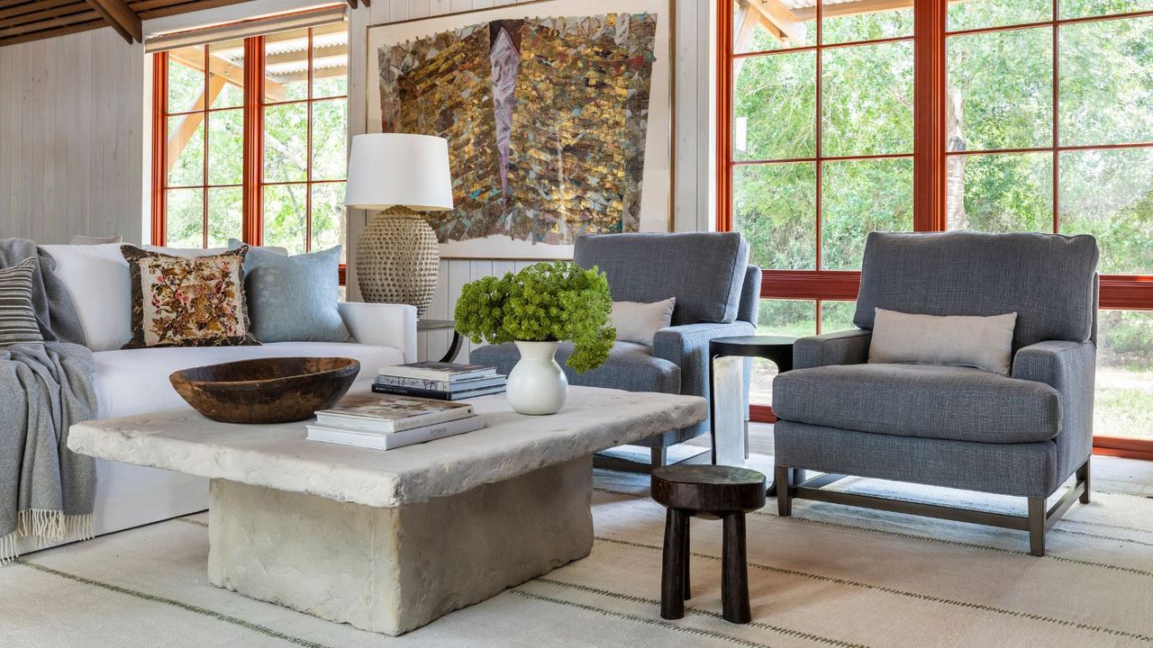 Living room the open plan space with grey chairs and red windows