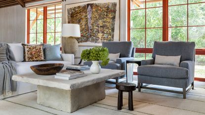 Living room the open plan space with grey chairs and red windows