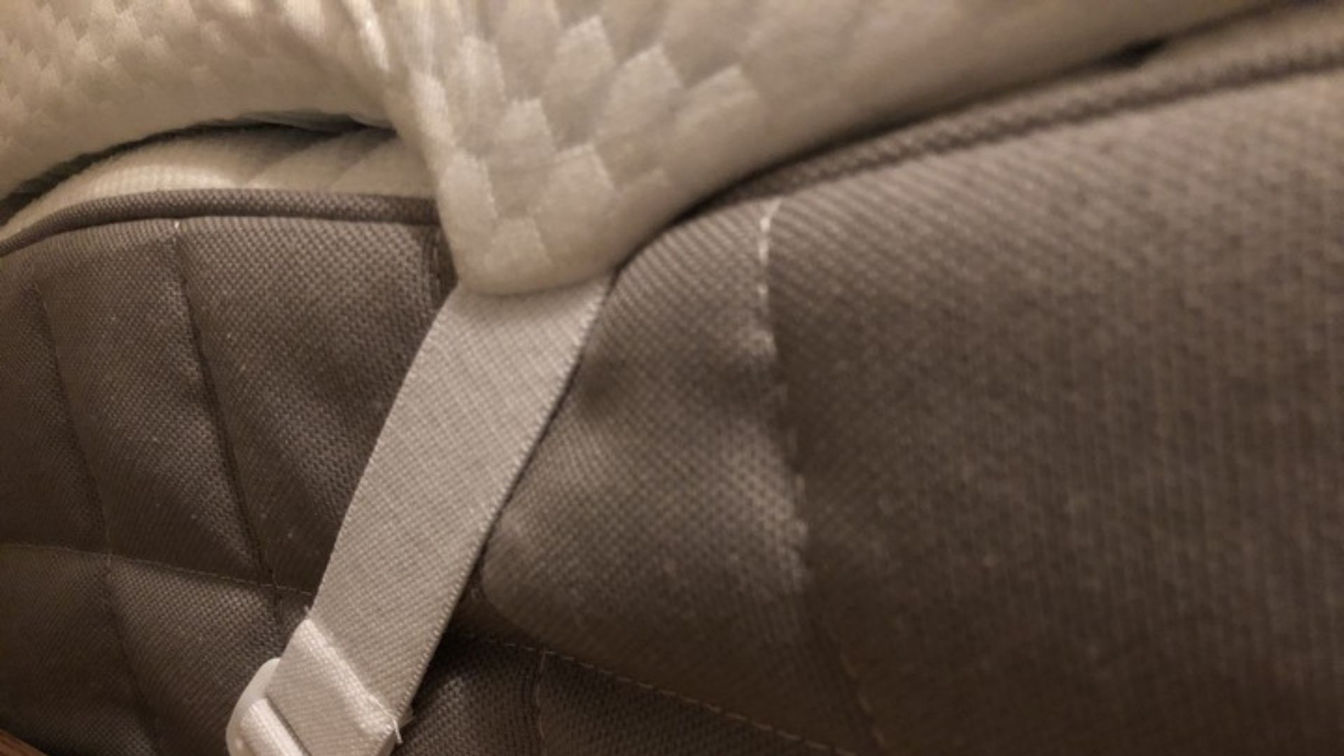 The anchor straps of the Panda London Bamboo Memory Foam Mattress Topper