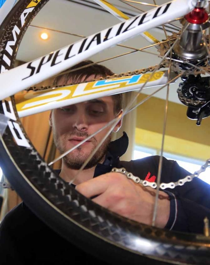 A team mechanic builds one the Astana bikes