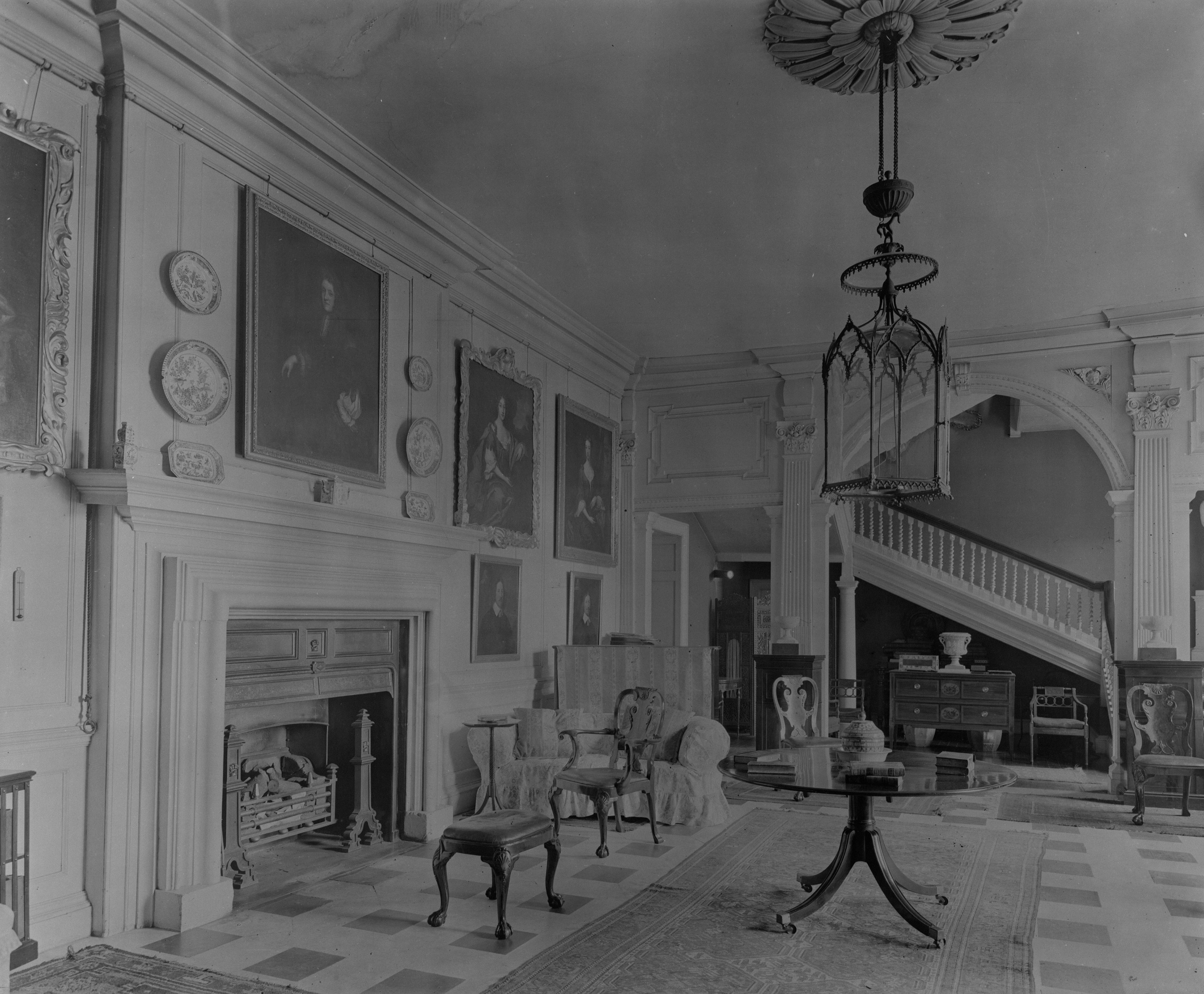 The entrance hall is suitably grand, with many portraits and another big fireplace