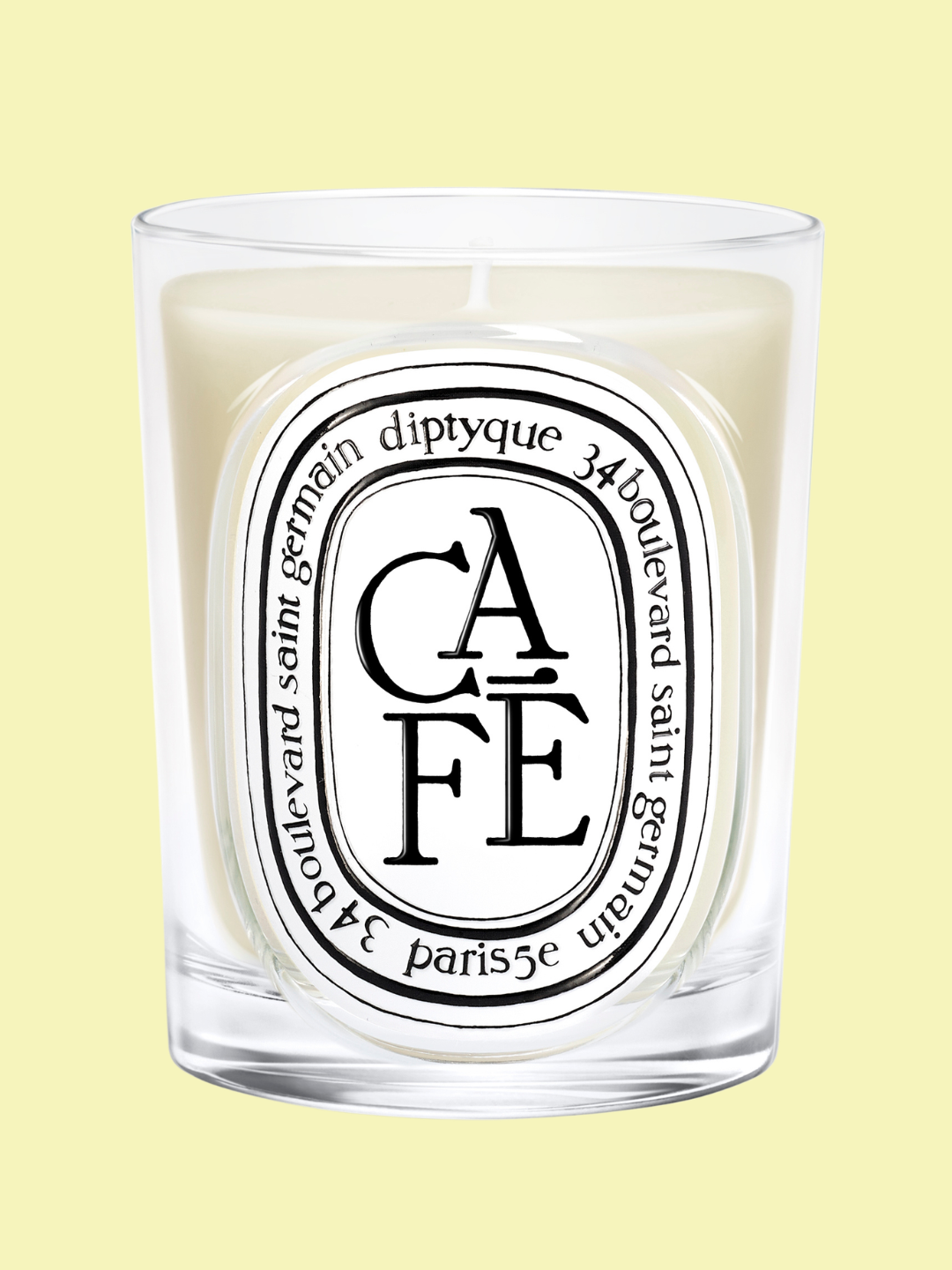 A coffee-scented candle from Diptyque in a glass vessel