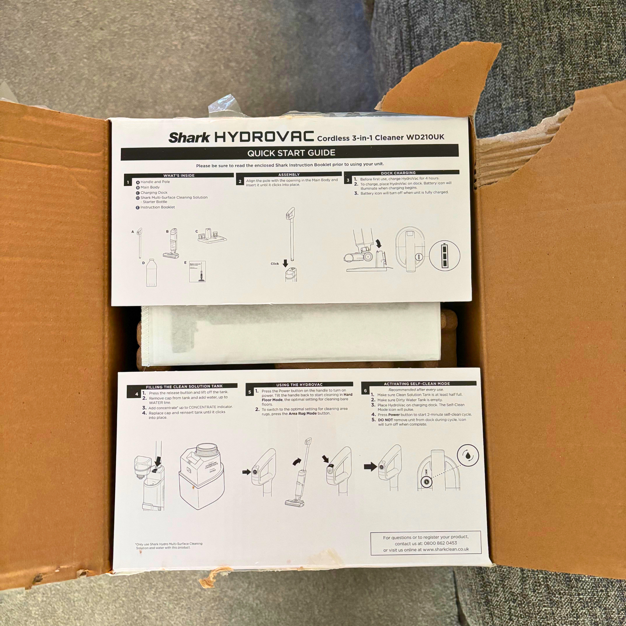 aerial view of inside of Shark HydroVac Cordless Hard Floor Cleaner packaging 