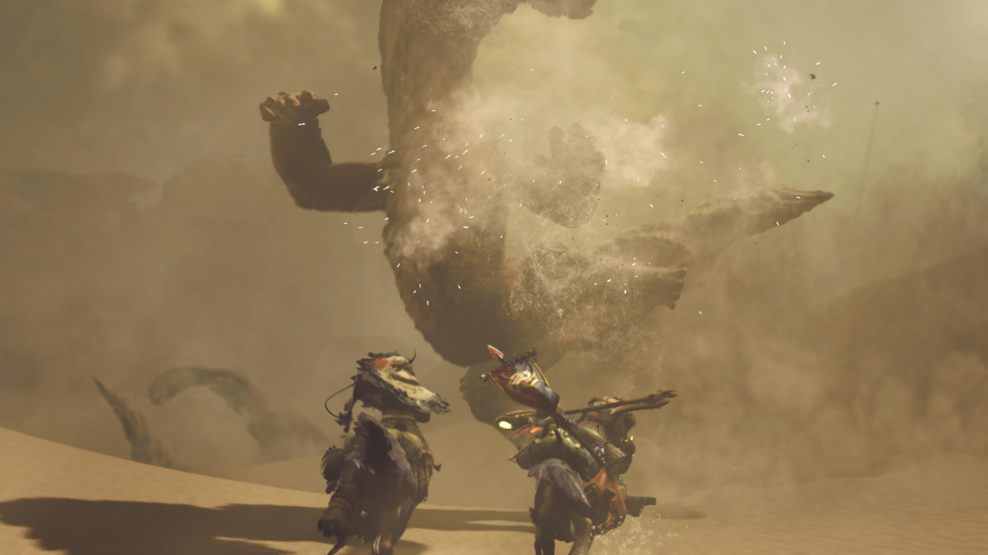 A Balahara erupts from beneath the sand, just in front of two mounted hunters riding through the desert