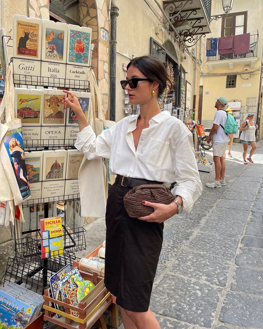 Woman wearing knee-length skirt outfit summer 2025.