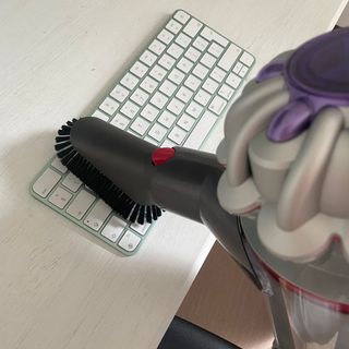 Using Dyson soft brush tool on a computer keyboard