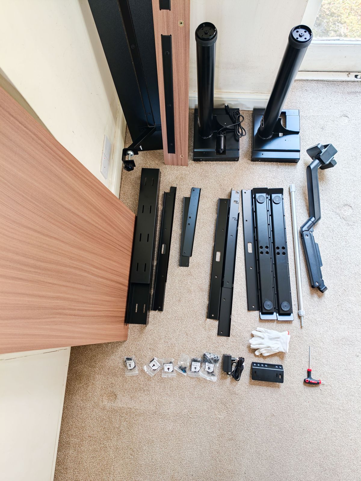 All of the pieces to build the Arozzi Arena Nordico Electric Standing Desk