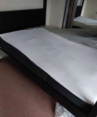 The Nectar Premier Hybrid Mattress on the floor.