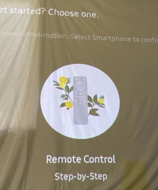 setting up the Samsung Freestyle projector on a portable screen