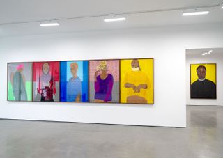 Installation view of Serge Attukwei Clottey's 'Beyond Skin' showing a row of portraits at Simchowitz Gallery, Los Angeles