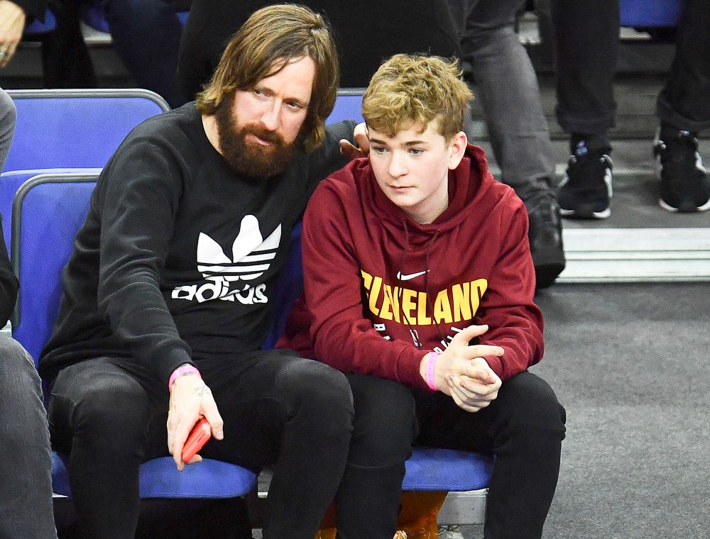 Bradley Wiggins (L) attends the Philadelphia 76ers and Boston Celtics NBA game at The O2 Arena on January 11, 2018, in London, England