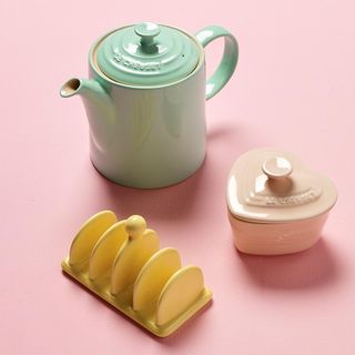 barnardos tea pot and ceramic pot with pink background