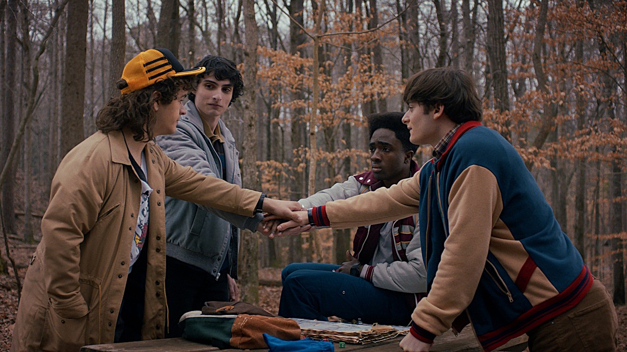 Gaten Matarazzo as Dustin Henderson, Finn Wolfhard as Mike Wheeler, Caleb McLaughlin as Lucas Sinclair and Noah Schnapp as Will Byers on Stranger Things Season 5.