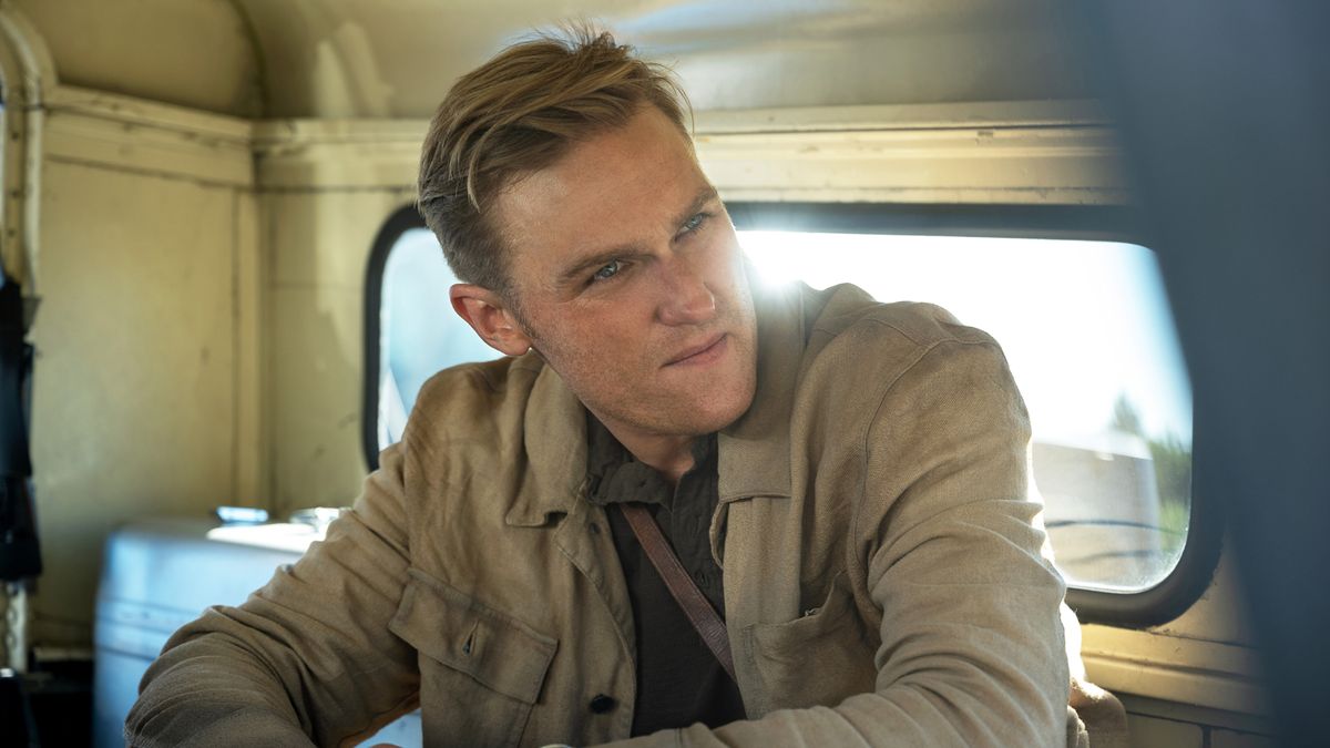 Wyatt Russell's young version of Lee Shaw sits in the back of a truck in Monarch: Legacy of Monsters