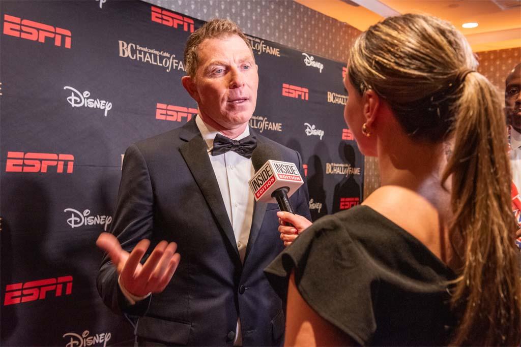 Honoree Bobby Flay of Food Network fame is interviewed on the red carpet.
