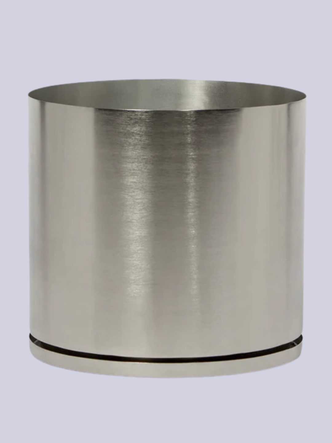 A brushed metal plant pot