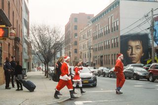 A troop of Santas roaming the streets in New York
