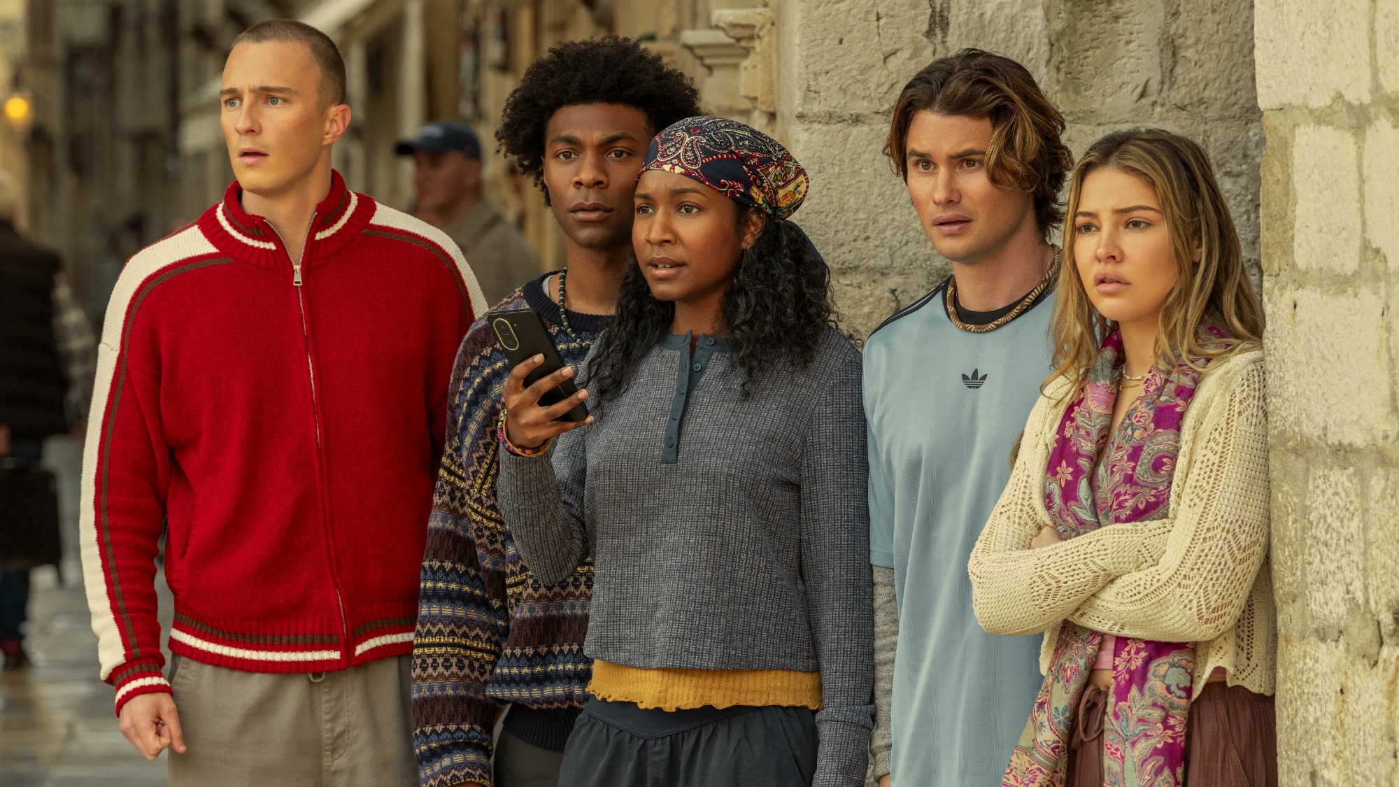 From left to right: (L to R) Drew Starkey as Rafe, Jonathan Daviss as Pope, Carlacia Grant as Cleo holding a phone, Chase Stokes as John B, Madelyn Cline as Sarah Cameron in Season 5 of Outer Banks.