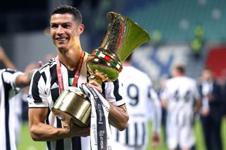 Cristiano Ronaldo celebrates with the Coppa Italia trophy after Juventus' win over Atalanta in the 2021 final.