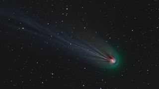 A comet with a spiral of light in its coma