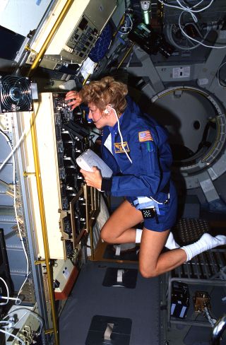 STS-40 payload specialist Millie Hughes-Fulford works inside the Space Life Sciences-1 (SLS-1) Spacelab module inside the space shuttle Columbia's payload bay in June 1991.