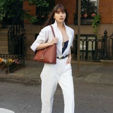 Natalie wearing Strathberry bag