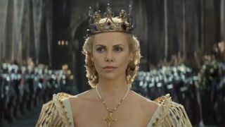 Charlize Theron in cage sleeve gold dress in Snow White and the Huntsman