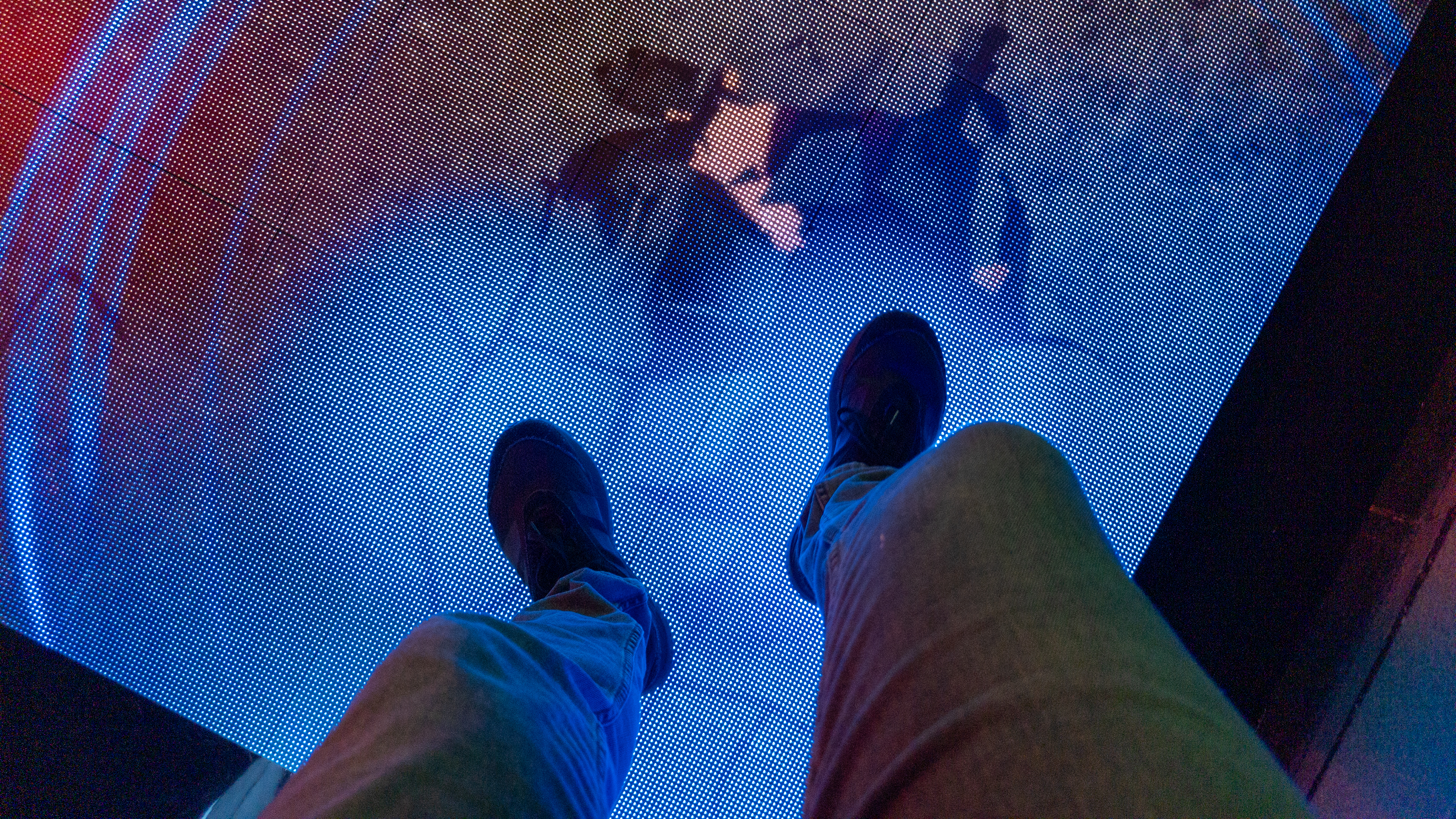 Stepping on a digital floor display at Google's San Diego Comic-Con Rewards Lab
