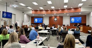 Conference room with a multi-display setup used for professional development/staff meeting.