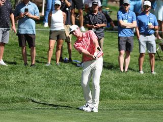 PGA Tour winner Nick Dunlap hitting a pitch shot from the first cut of rough