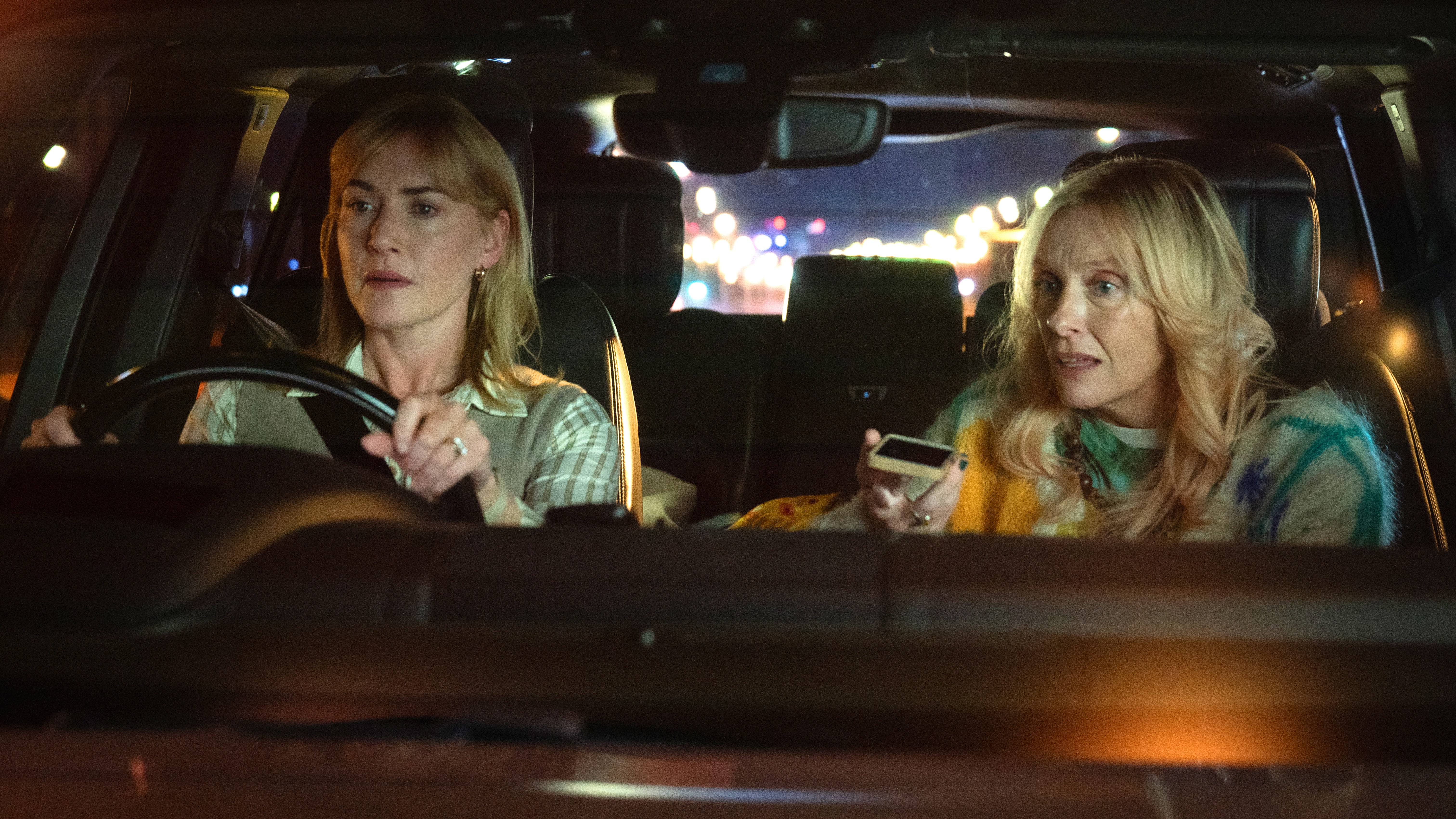 L-R: Kate Winslet and Toni Collette inside a car in a scene from "Goodbye June"