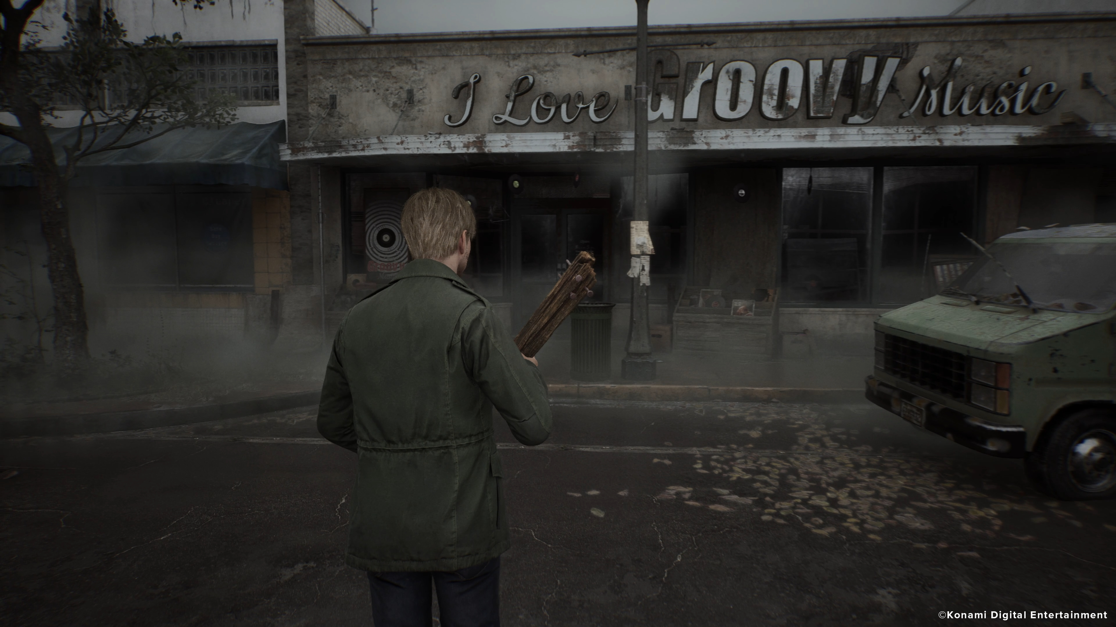 In Silent Hill 2, James approaches the front of a store armed with a piece of wood.