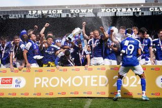 Ipswich Town players celebrate the club's promotion to the Premier League