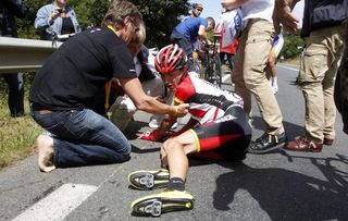 Janez Brajkovic is helped up after his crash