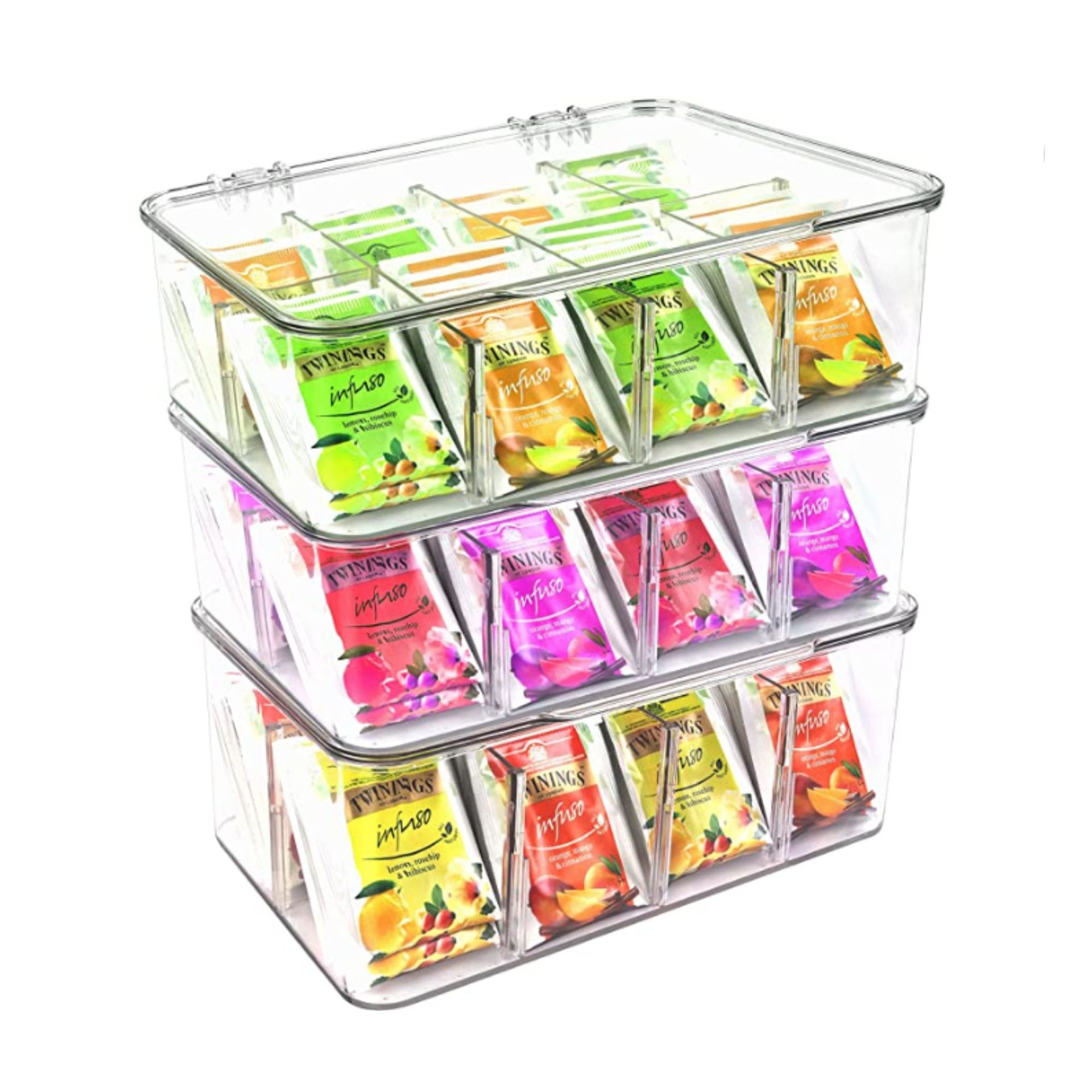 Tumpukan tiga pengatur akrilik dengan kantong teh di dalamnya