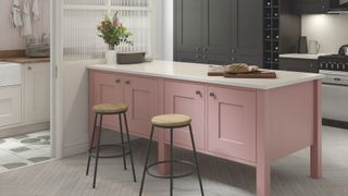shaker kitchen with pink peninsula unit