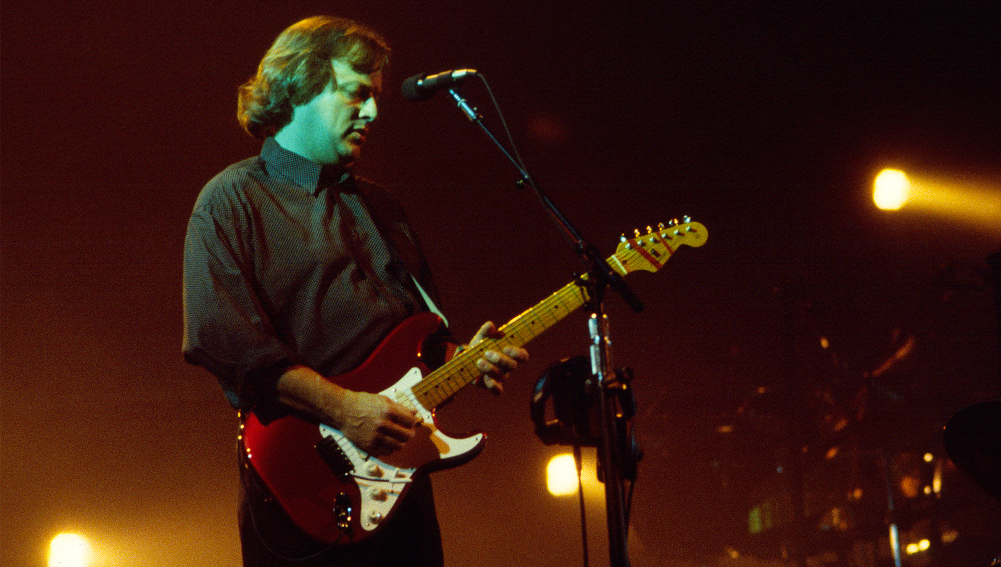 English Rock musician David Gilmour, of the group Pink Floyd, plays guitar as he performs onstage at Madison Square Garden, New York, New York, October 7, 1987.