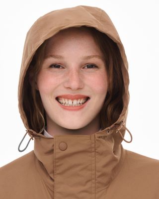 Close up of smiling woman in hood