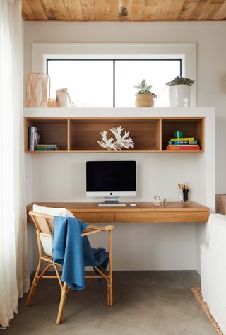 Home office with floating desk and shelves