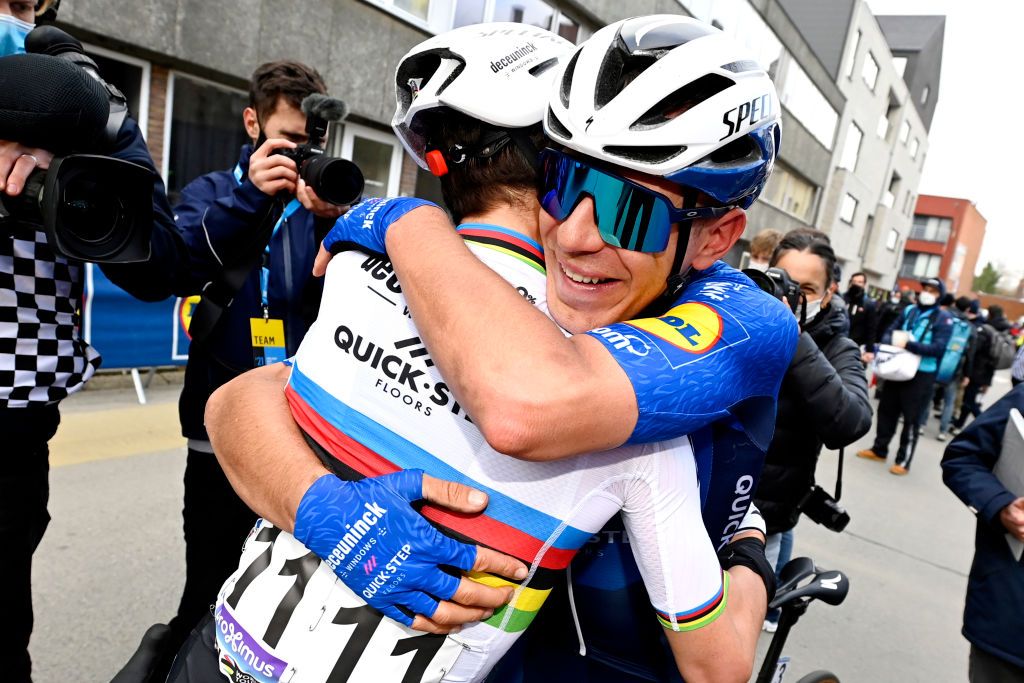 Davide Ballerini hugs Deceuninck-QuickStep teammate Julian Alaphilippe after winning Omloop Het Nieuwsblad