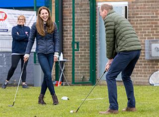 Catherine, Duchess of Cambridge and Prince William, Duke of Cambridge play Gold as they meet young people supported by the Cheesy Waffles Project, a charity for children, young people and adults with additional needs across County Durham, at the Belmont Community Centre on April 27, 2021 in Durham, United Kingdom