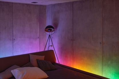 rainbow smart lighting behind a bed