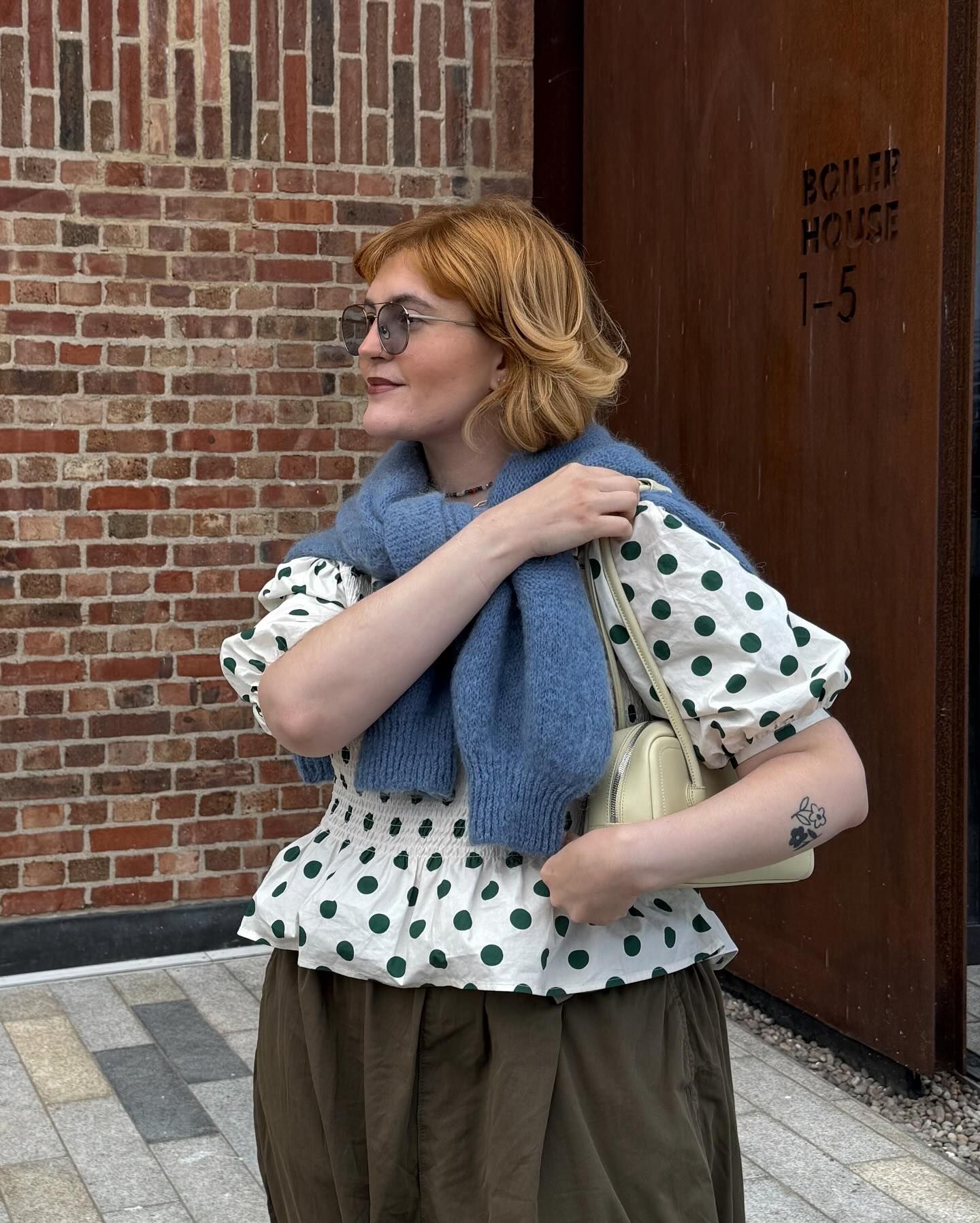 Influencer wears the Shrimps polkadot blouse