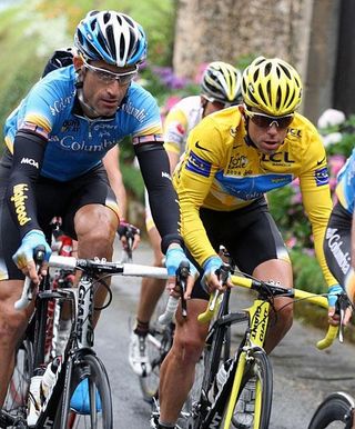 Hincapie at the side of yellow jersey and team captain Kim Kirchen.