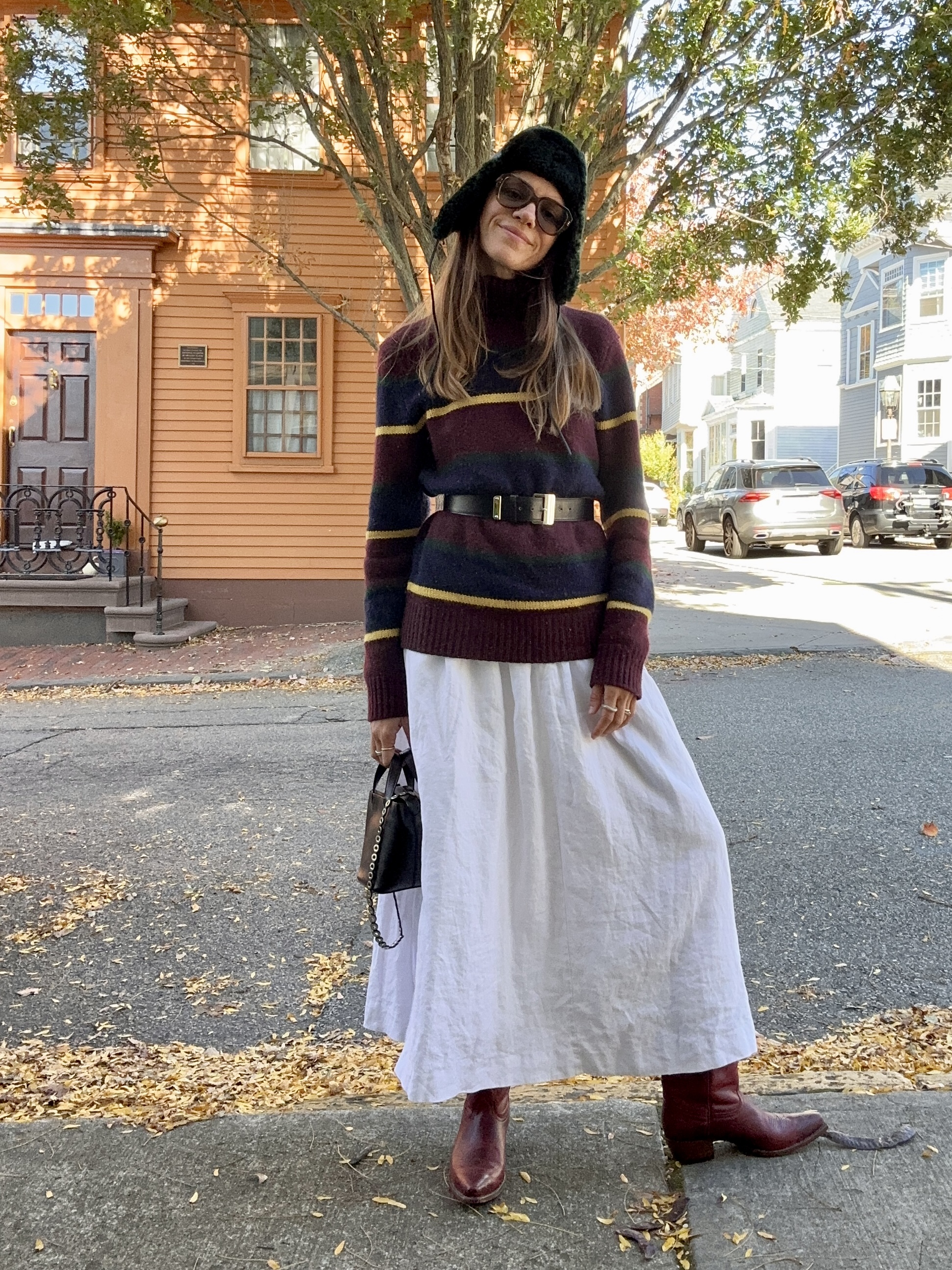 julia gall wearing a striped sweater outfit