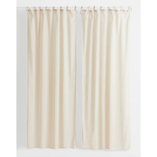 a pair of cream linen curtains
