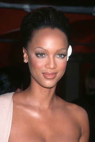 Tyra Banks with feathered lashes and white eyeliner