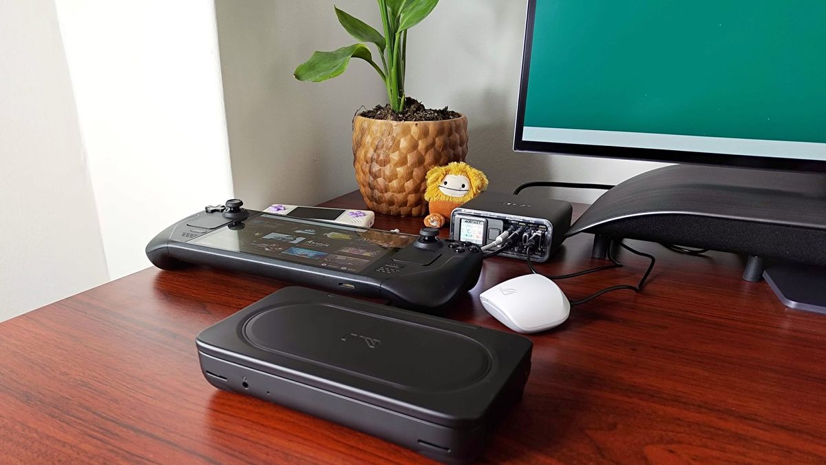Acefast Desktop Powerstation Z4 sitting on desk with Steam Deck OLED, Ayaneo Flip DS, and Asus wireless earbuds connected