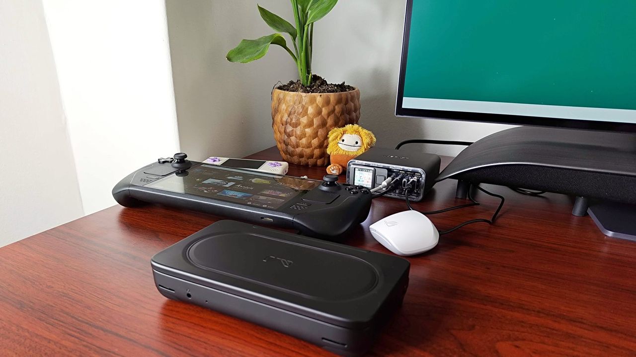 Acefast Desktop Powerstation Z4 sitting on desk with Steam Deck OLED, Ayaneo Flip DS, and Asus wireless earbuds connected
